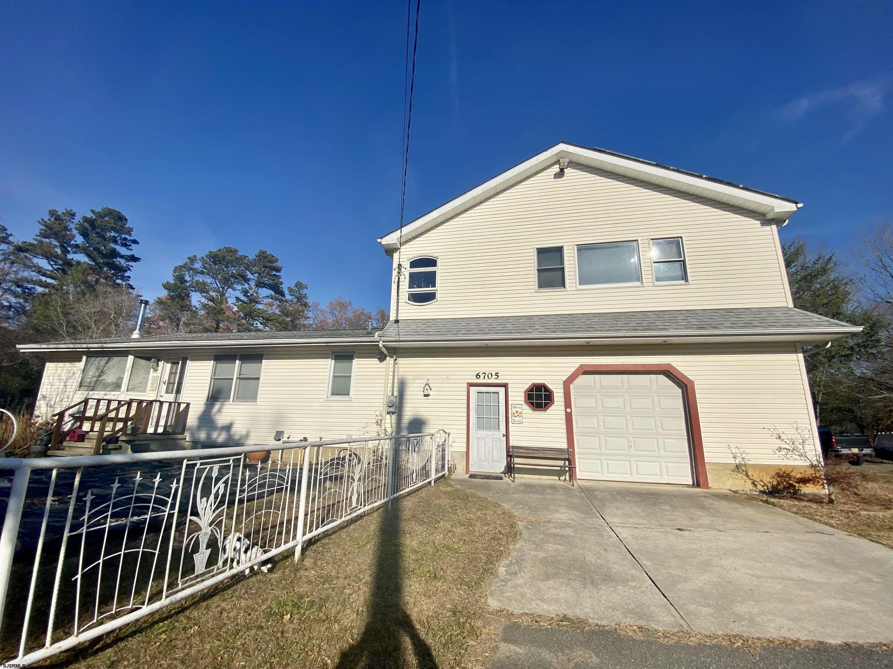 6705 Weymouth Road Mays Landing, NJ 08330 - Photo 2 of 38 a view of a house with wooden fence