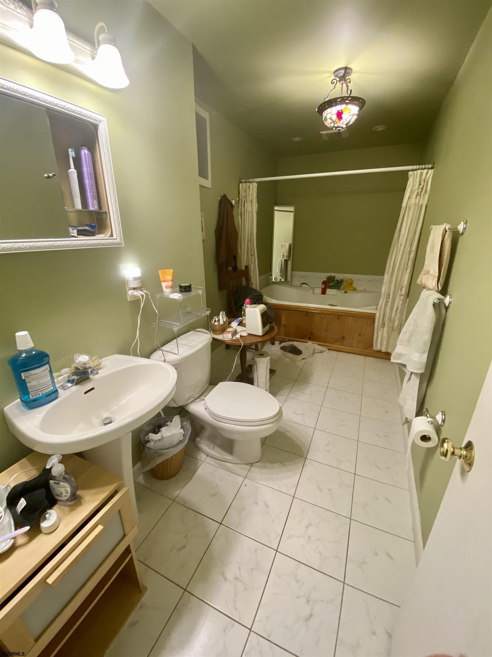 6705 Weymouth Road Mays Landing, NJ 08330 - Photo 23 of 38 a bathroom with a sink mirror and toilet