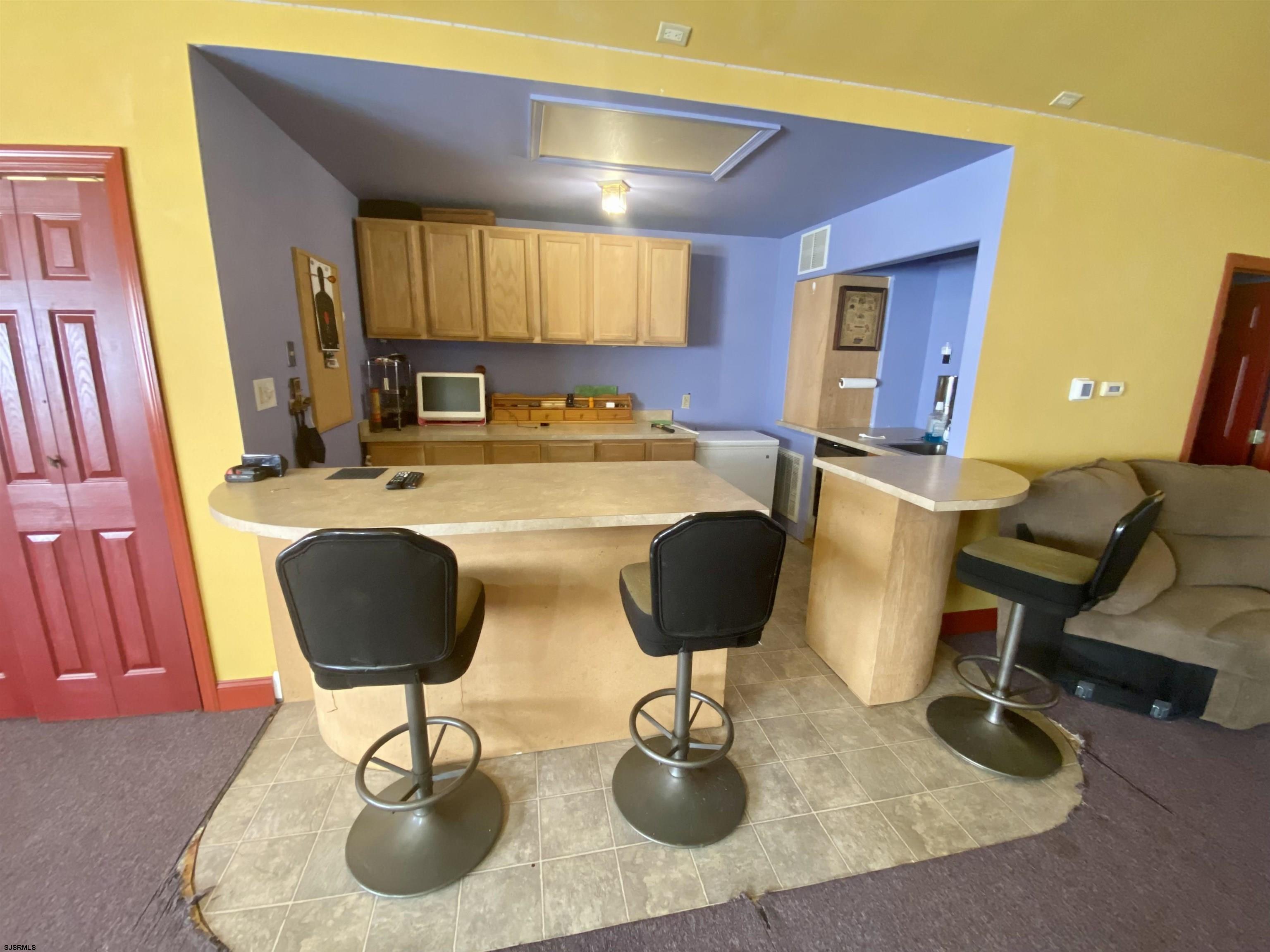 6705 Weymouth Road Mays Landing, NJ 08330 - Photo 29 of 38 a kitchen with a table and chairs