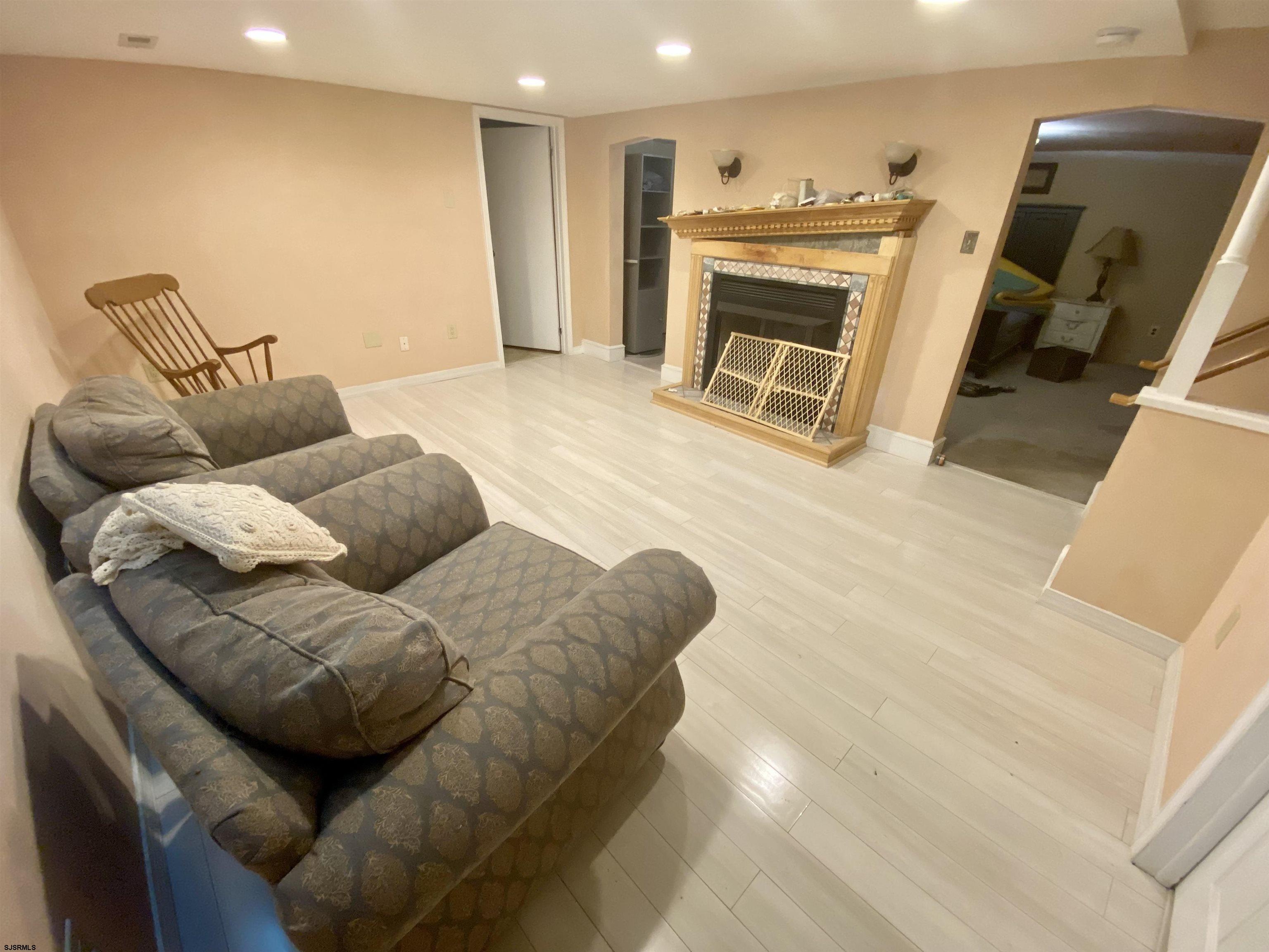 6705 Weymouth Road Mays Landing, NJ 08330 - Photo 33 of 38 a living room with furniture and a fireplace