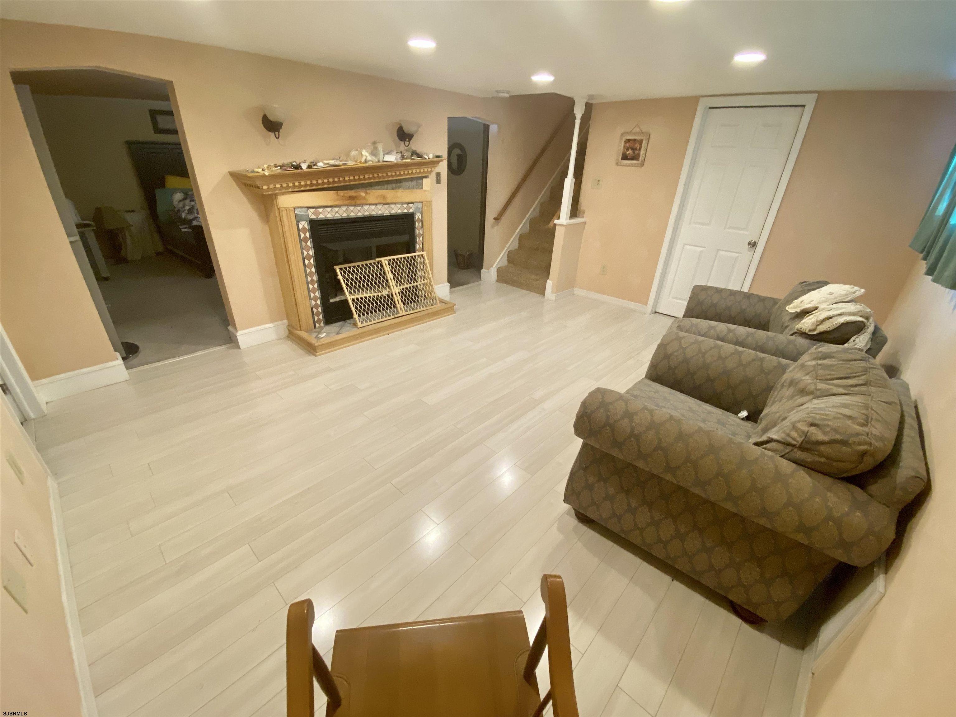 6705 Weymouth Road Mays Landing, NJ 08330 - Photo 34 of 38 a living room with furniture and a fireplace