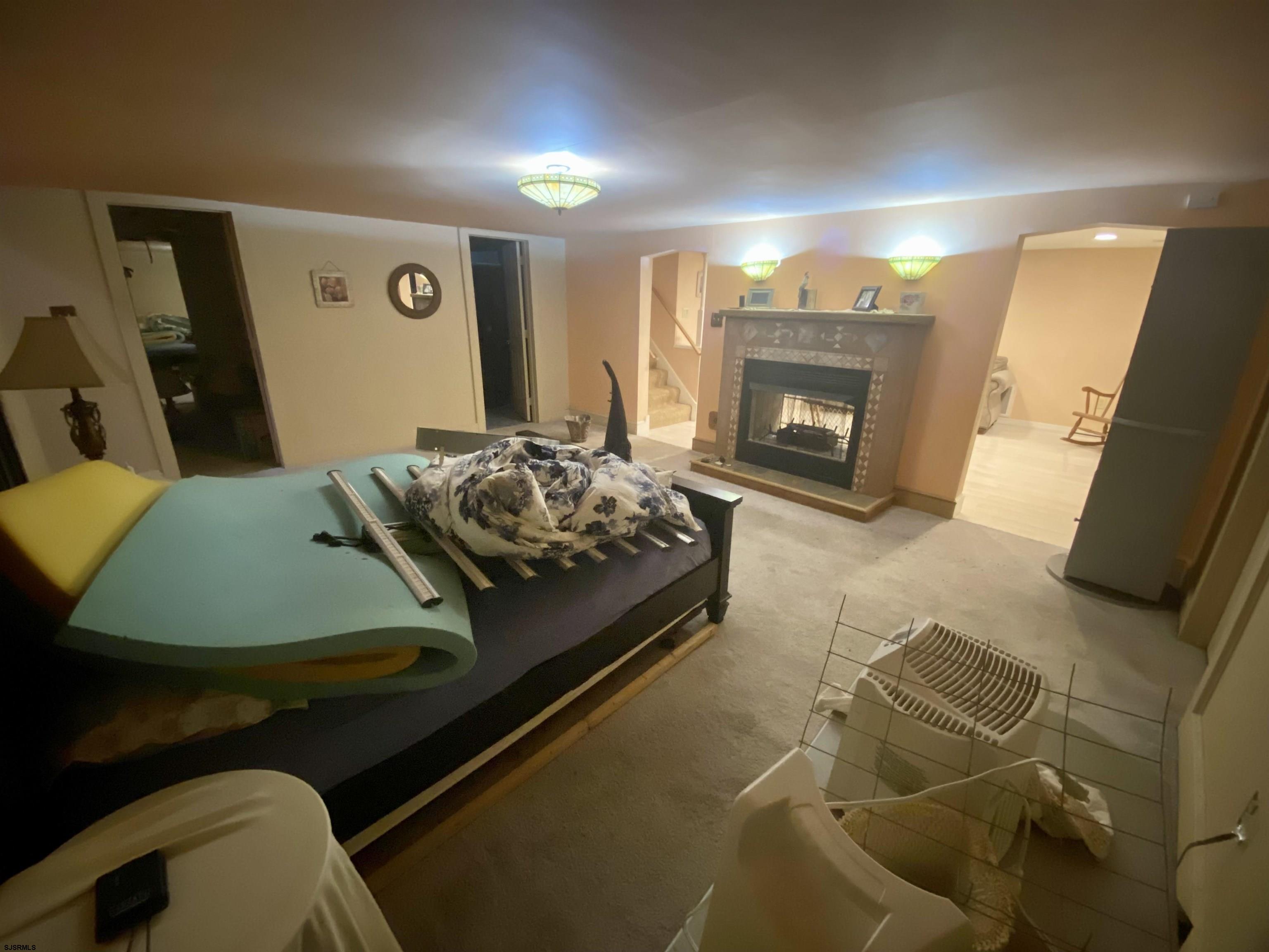 6705 Weymouth Road Mays Landing, NJ 08330 - Photo 36 of 38 a living room with furniture and a fireplace