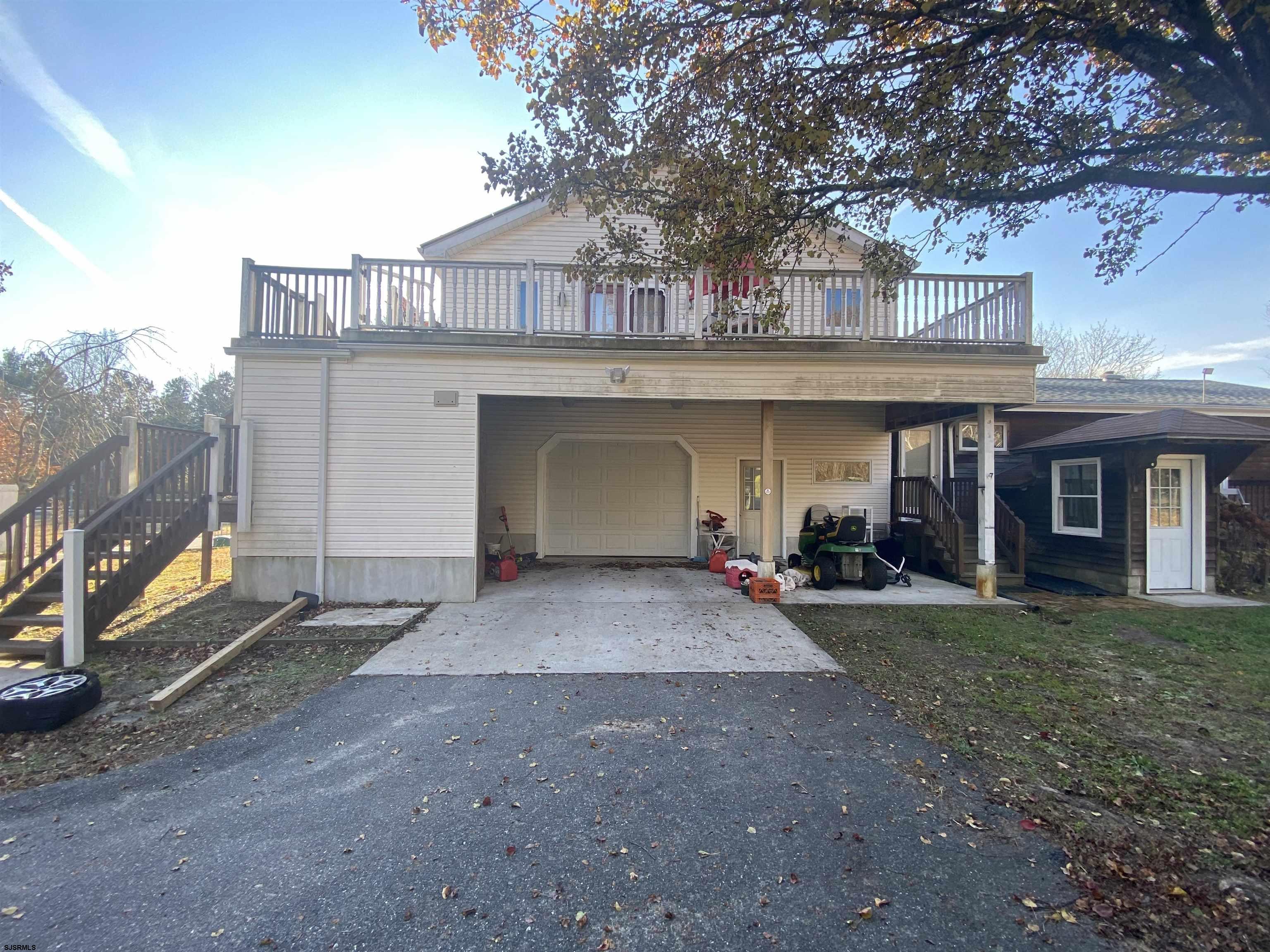 6705 Weymouth Road Mays Landing, NJ 08330 - Photo 5 of 38 a view of a house with basket ball court and a garage