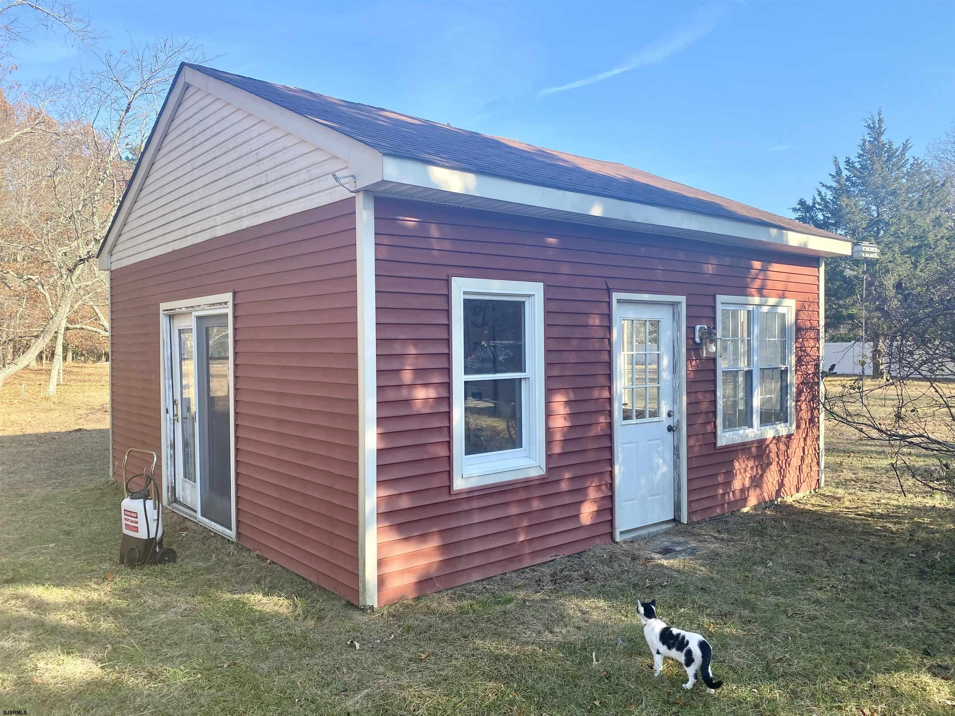 6705 Weymouth Road Mays Landing, NJ 08330 - Photo 9 of 38 a view of a brick house with a yard