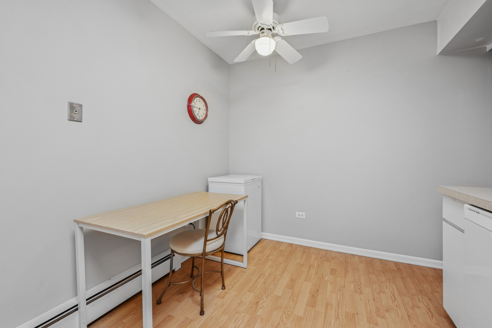 2033 Sherman Avenue, Unit 504 Evanston, IL 60201 - Photo 12 of 23 a view of a workspace with furniture and a fan