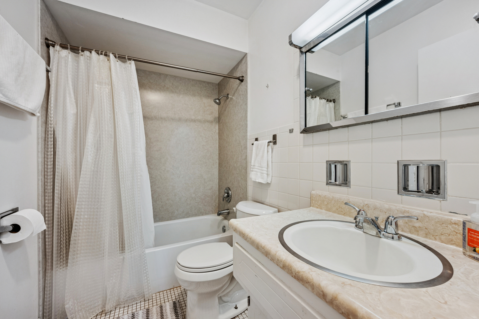 2033 Sherman Avenue, Unit 504 Evanston, IL 60201 - Photo 13 of 23 a bathroom with a sink toilet and shower
