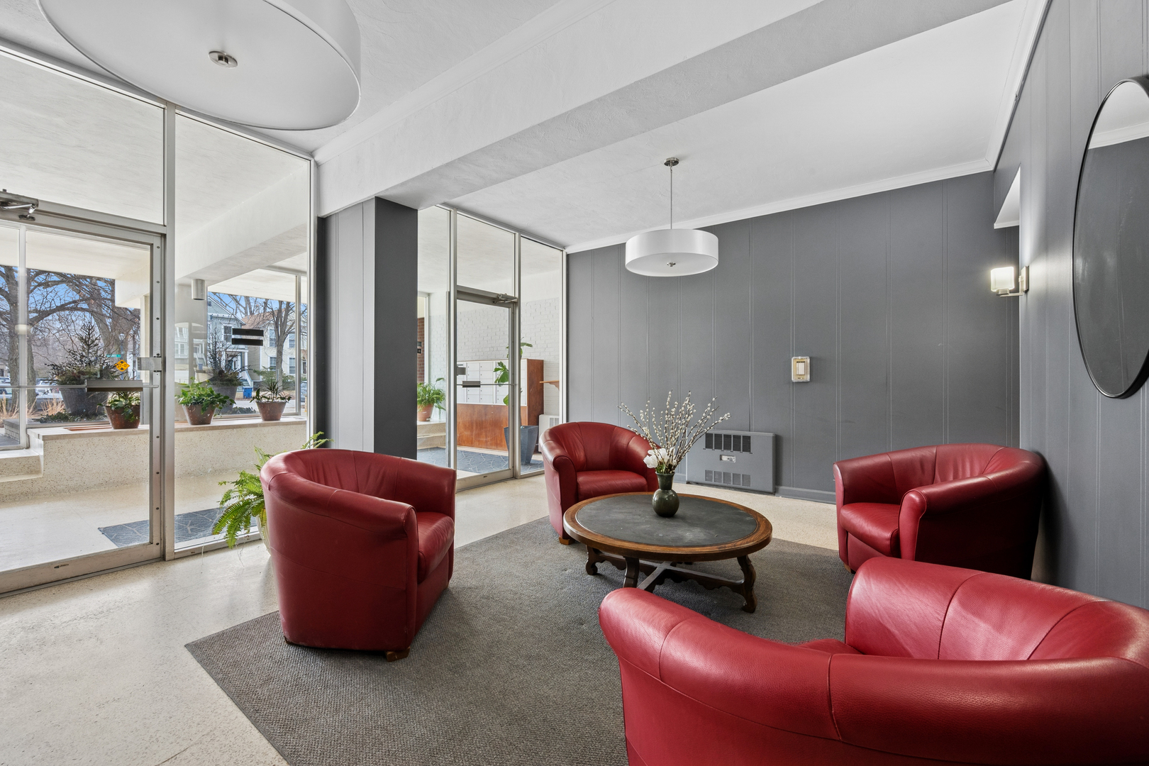 2033 Sherman Avenue, Unit 504 Evanston, IL 60201 - Photo 3 of 23 a living room with furniture a rug and a large window
