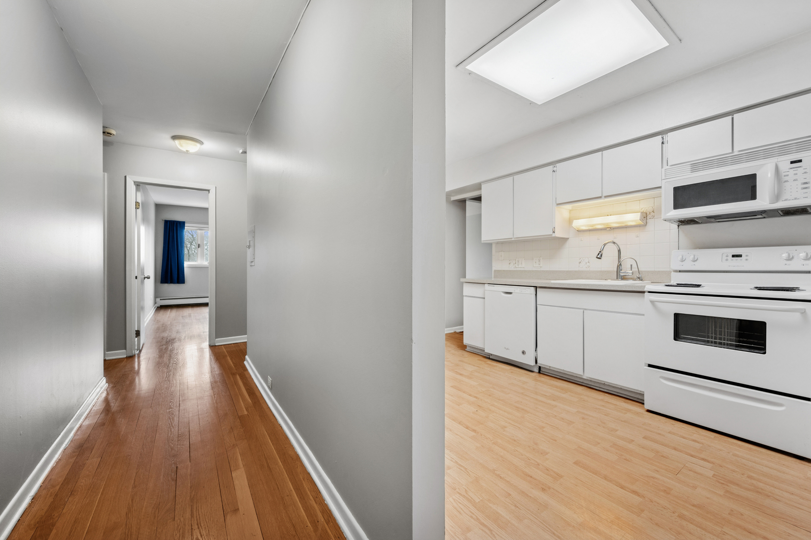 2033 Sherman Avenue, Unit 504 Evanston, IL 60201 - Photo 4 of 23 a kitchen with a sink a stove and cabinets