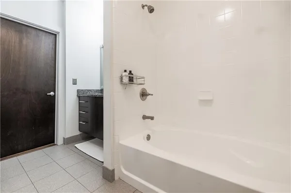 a bathroom with a bathtub and shower