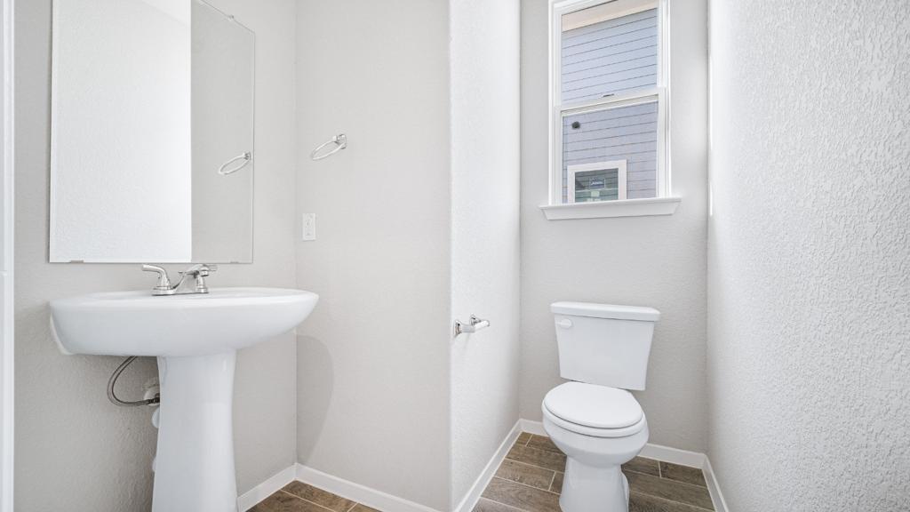208 Stein Road Georgetown, TX 78626 - Photo 28 of 30 Bathroom featuring toilet and baseboards
