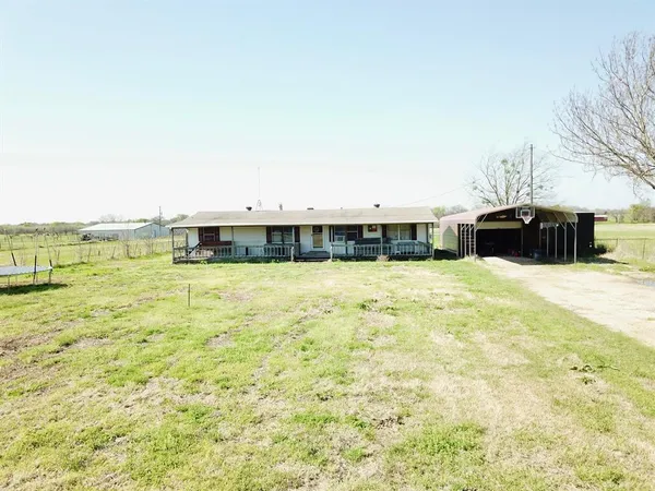 a swimming pool that is in front of a building