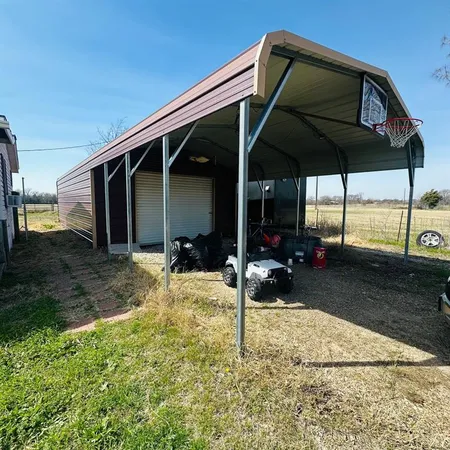 a view of a house with backyard and porch