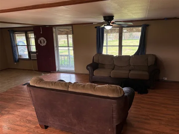 a living room with furniture and window