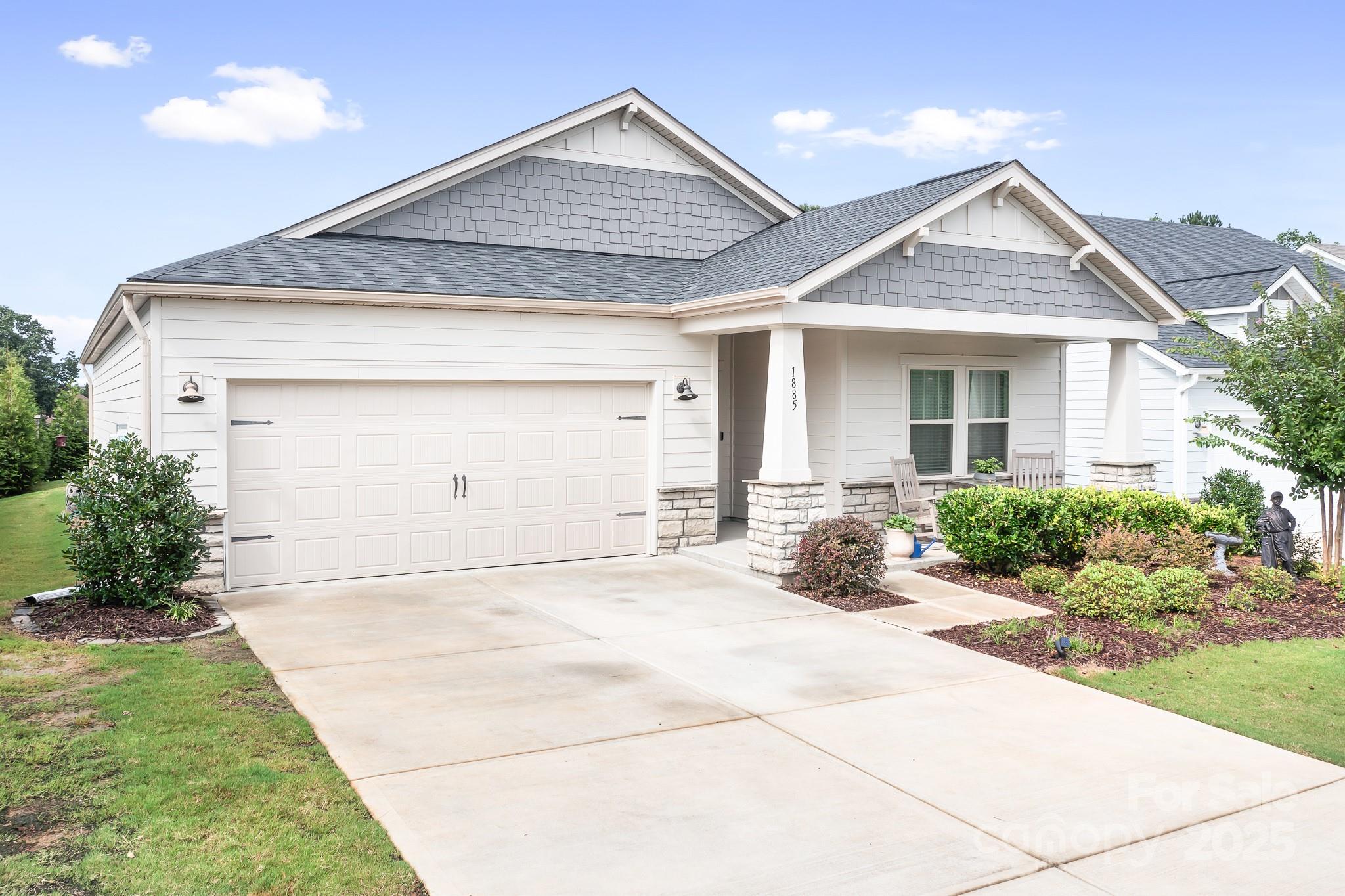 1885 Lotus Lane Denver, NC 28037 - Photo 1 of 43 a front view of a house with a yard and garage
