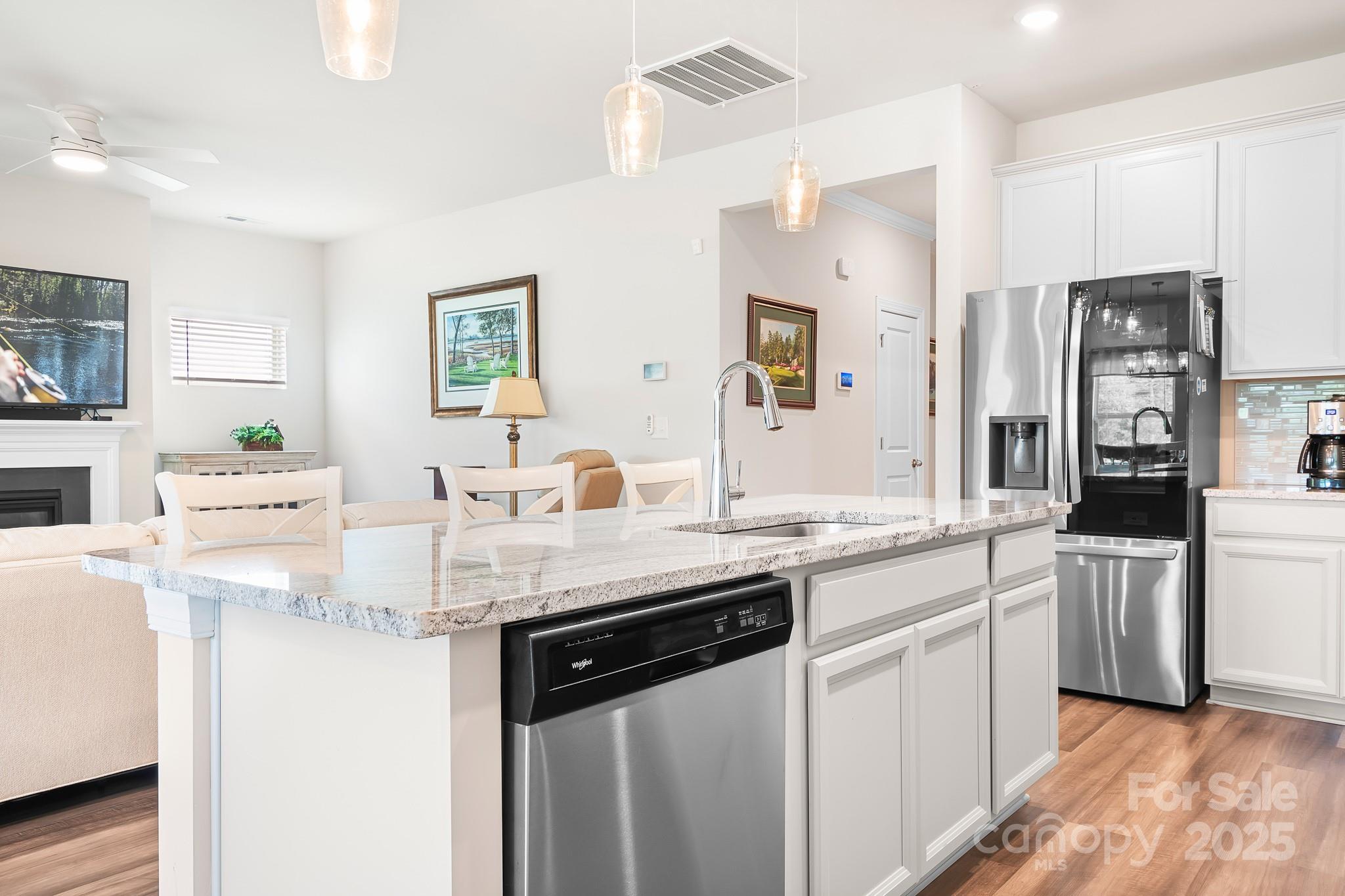 1885 Lotus Lane Denver, NC 28037 - Photo 11 of 43 a kitchen with stainless steel appliances granite countertop a sink stove and refrigerator