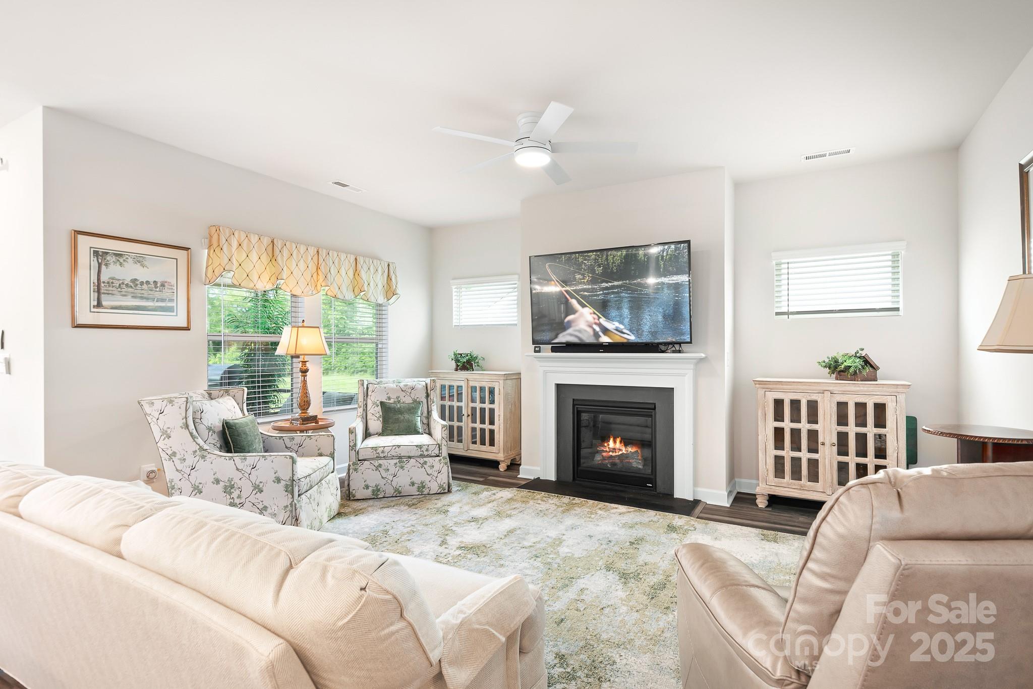 1885 Lotus Lane Denver, NC 28037 - Photo 14 of 43 a living room with furniture a fireplace and a flat screen tv