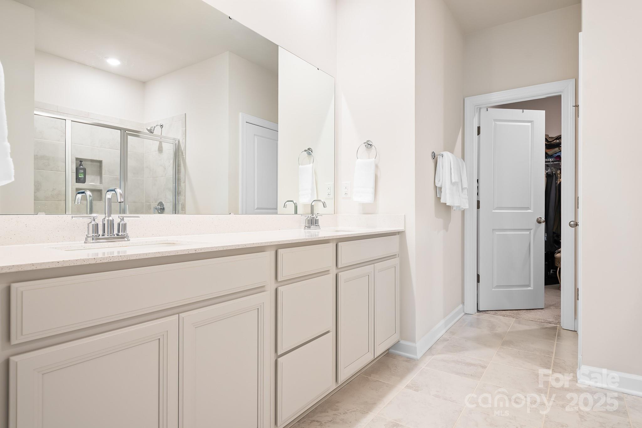 1885 Lotus Lane Denver, NC 28037 - Photo 17 of 43 a bathroom with a double vanity sink mirror and