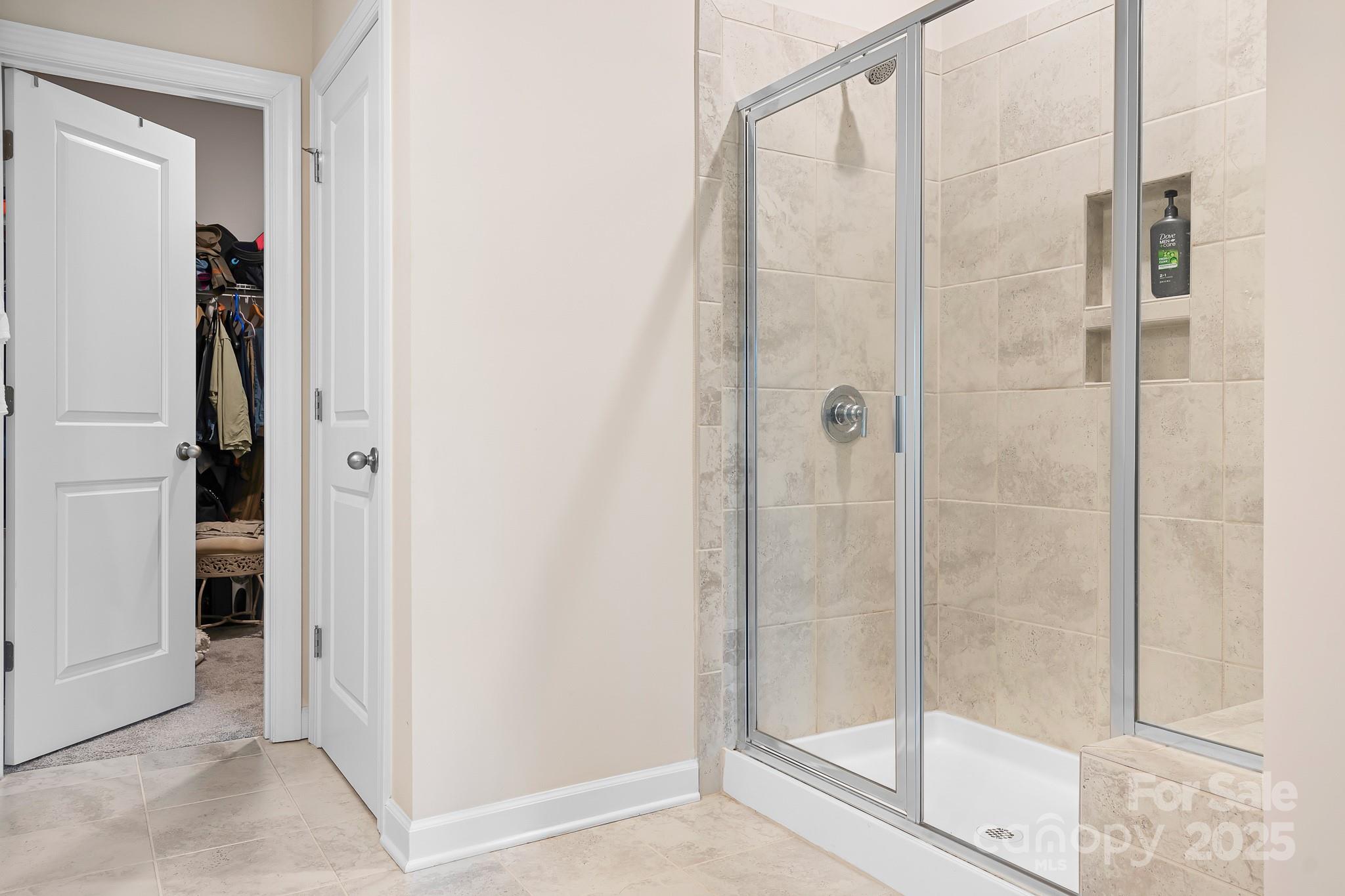 1885 Lotus Lane Denver, NC 28037 - Photo 19 of 43 a bathroom with a glass shower door