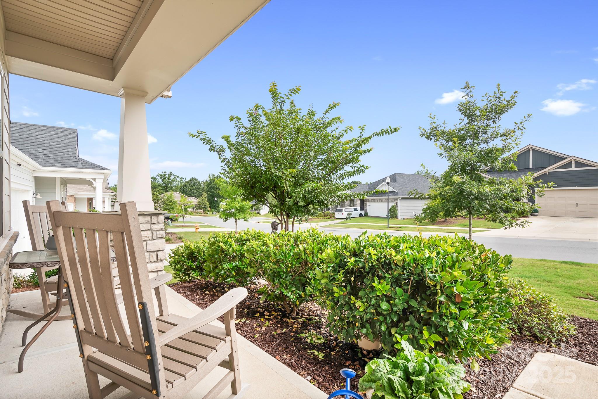 1885 Lotus Lane Denver, NC 28037 - Photo 2 of 43 a view of a chairs and table in the garden