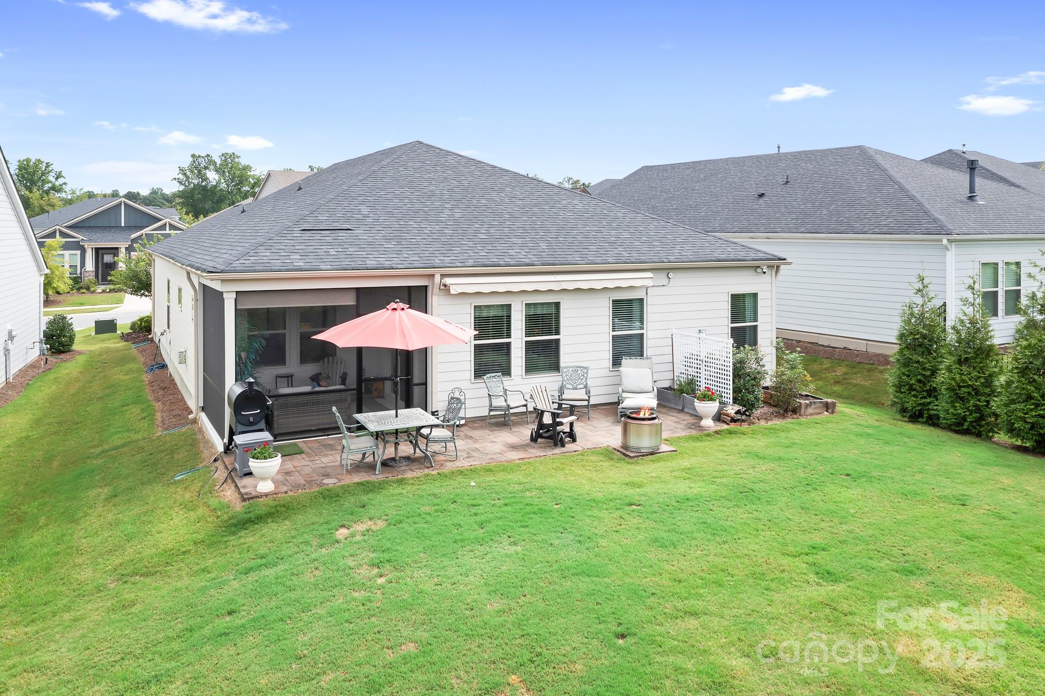 1885 Lotus Lane Denver, NC 28037 - Photo 28 of 43 a view of a house with backyard porch and sitting area