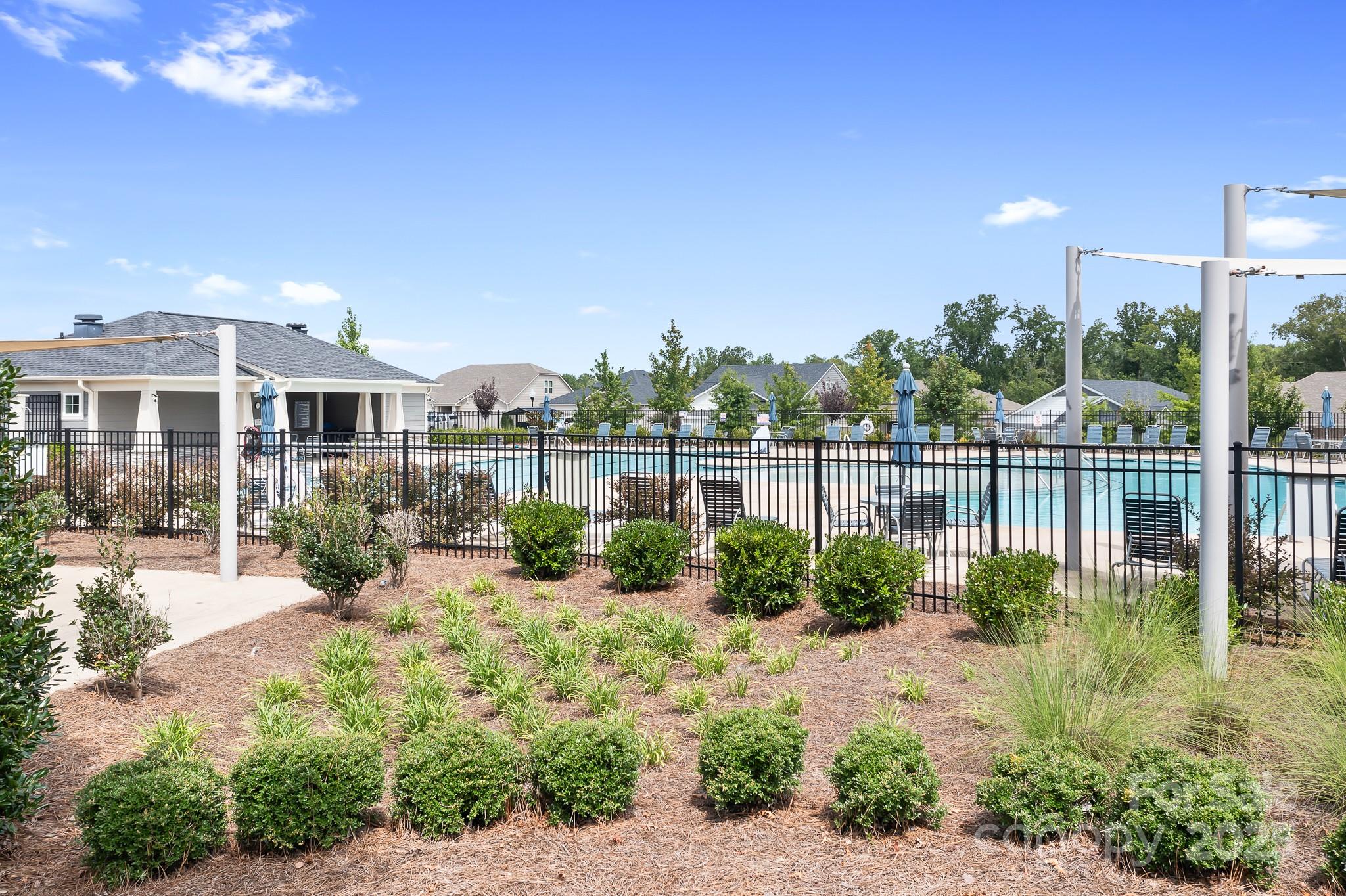 1885 Lotus Lane Denver, NC 28037 - Photo 34 of 43 a view of a house with a yard and potted plants