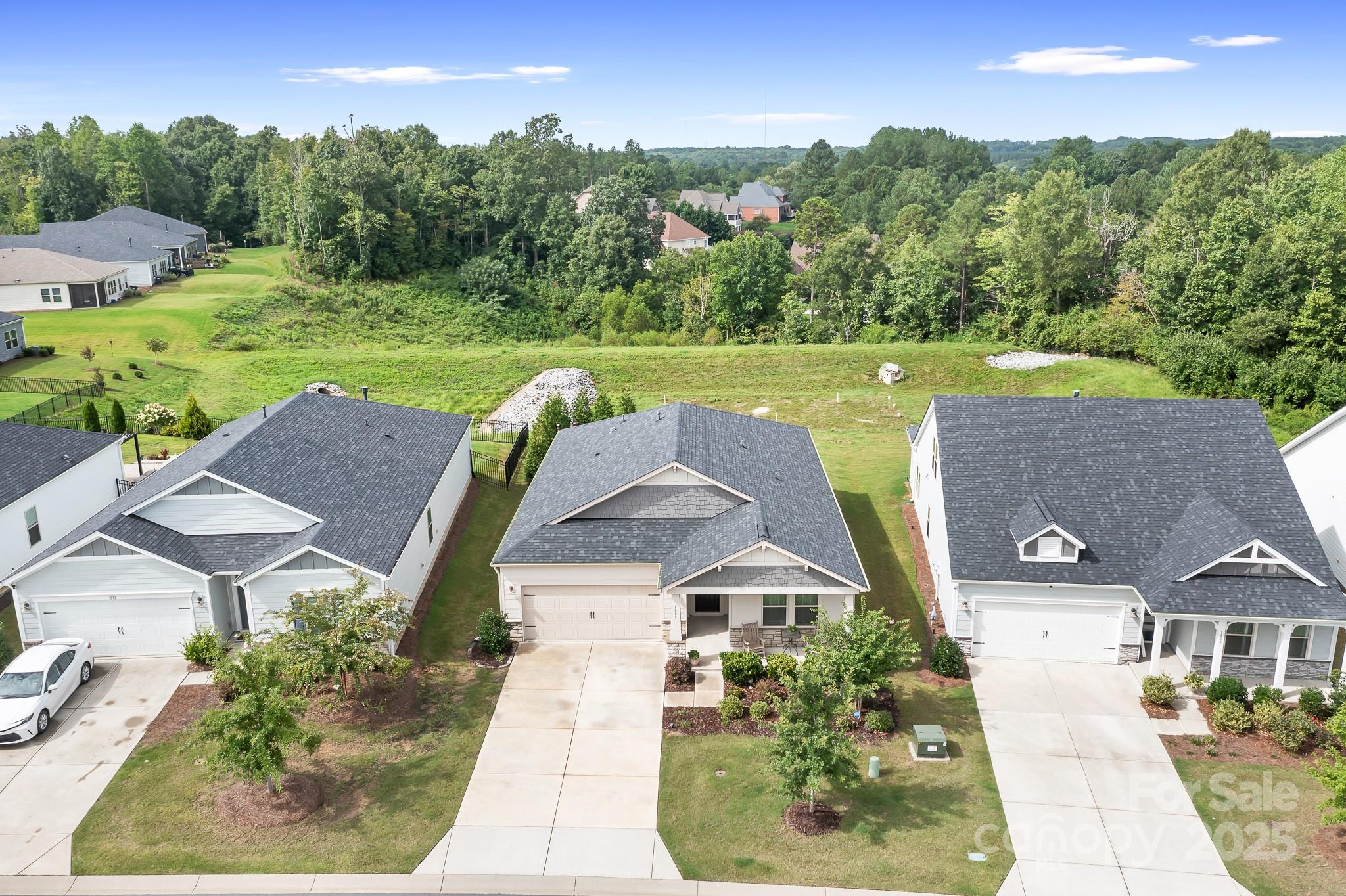 1885 Lotus Lane Denver, NC 28037 - Photo 38 of 43 an aerial view of a house with garden space and a car parked