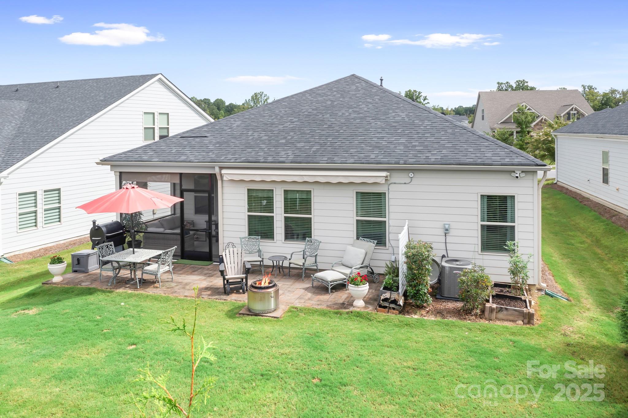 1885 Lotus Lane Denver, NC 28037 - Photo 43 of 43 a backyard of a house with table and chairs