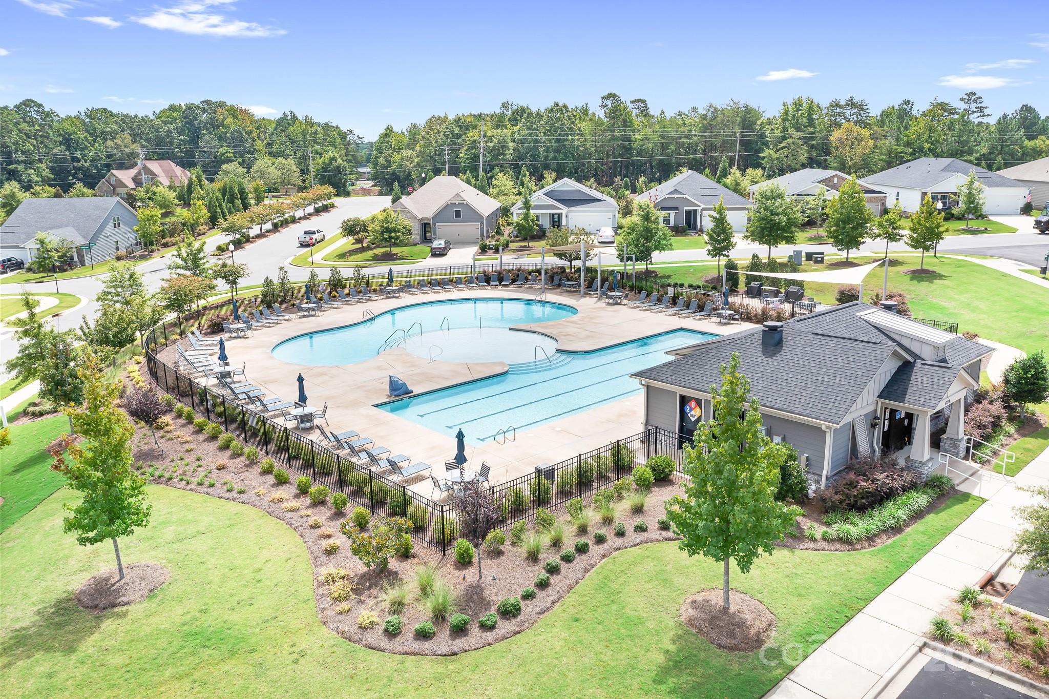 1885 Lotus Lane Denver, NC 28037 - Photo 6 of 43 a view of a swimming pool with a yard