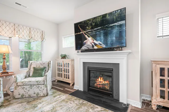 a kitchen with stainless steel appliances kitchen island granite countertop a stove a sink and a refrigerator