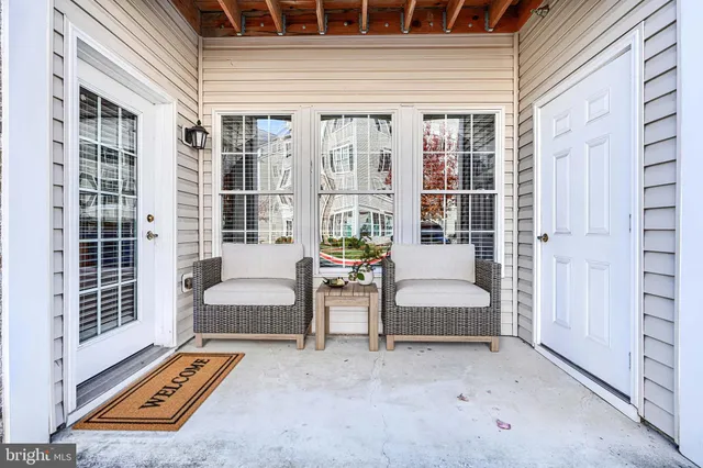 a backyard of a house with sofas