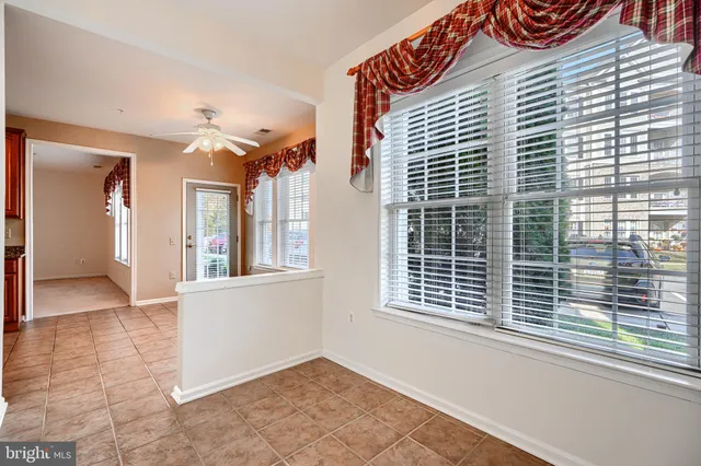 a spacious bathroom with a granite countertop sink a mirror and a
