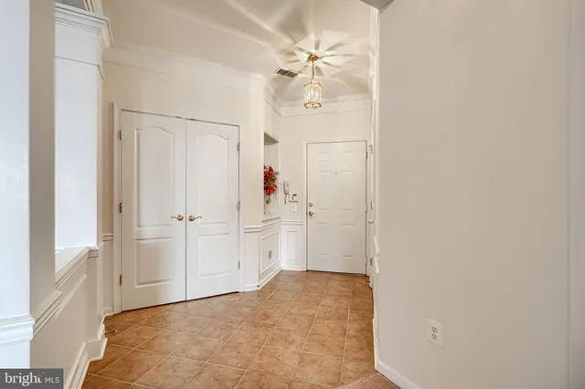 a view of a livingroom with a chandelier fan
