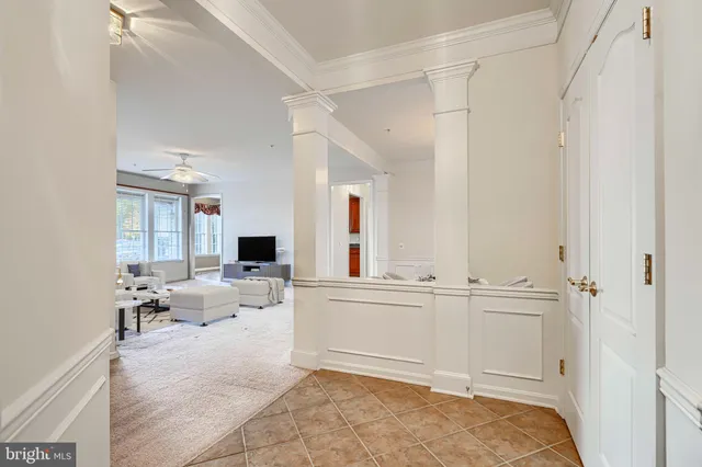 a view of an empty room with a ceiling fan