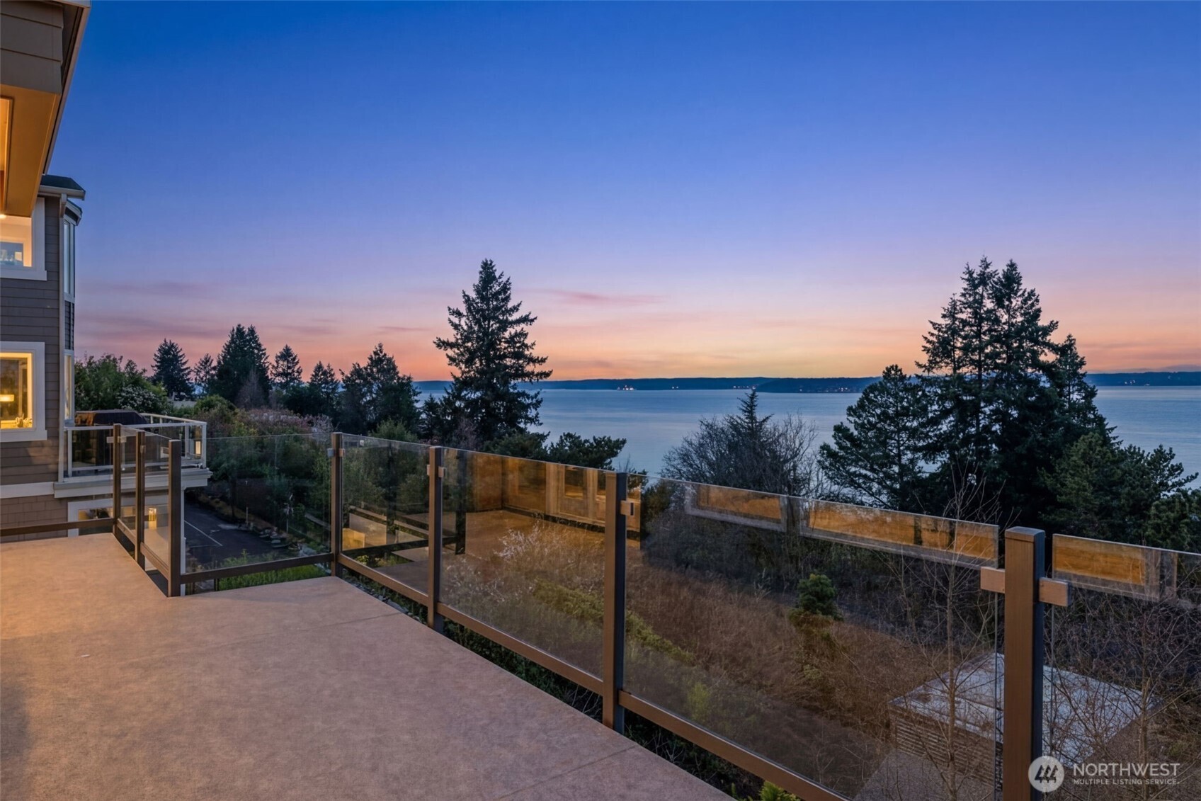 4017 56th Avenue Southwest Seattle, WA 98116 - Photo 11 of 39 a view of a terrace with a bench and sky view