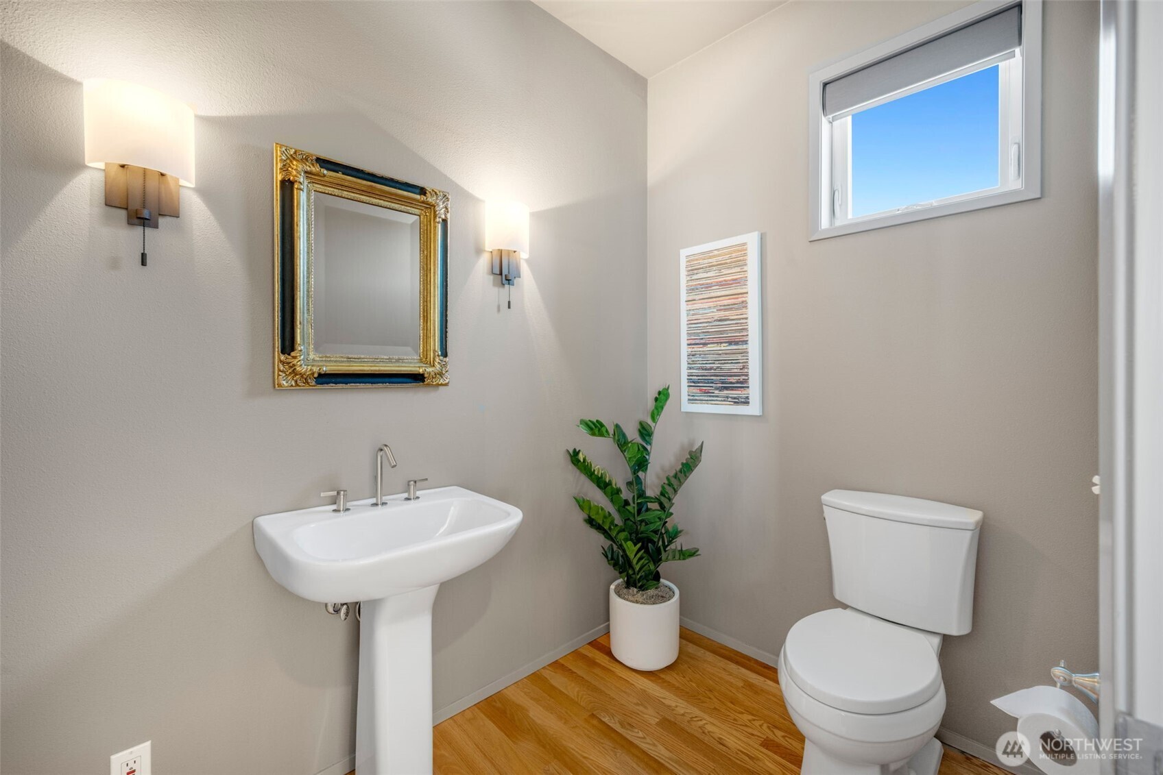 4017 56th Avenue Southwest Seattle, WA 98116 - Photo 12 of 39 a bathroom with a toilet sink and mirror