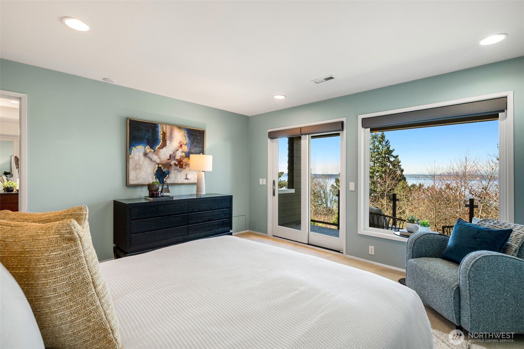 4017 56th Avenue Southwest Seattle, WA 98116 - Photo 13 of 39 a bedroom with a bed and a large window