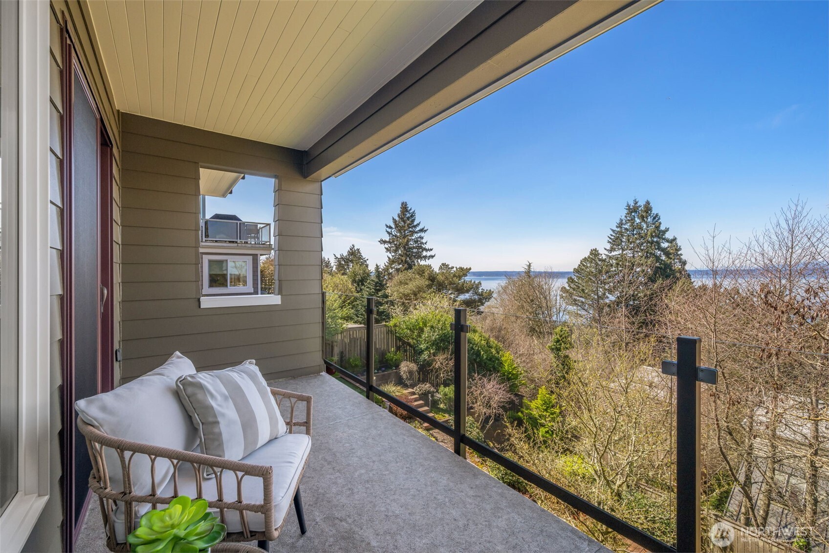 4017 56th Avenue Southwest Seattle, WA 98116 - Photo 20 of 39 a view of a balcony with furniture and city view