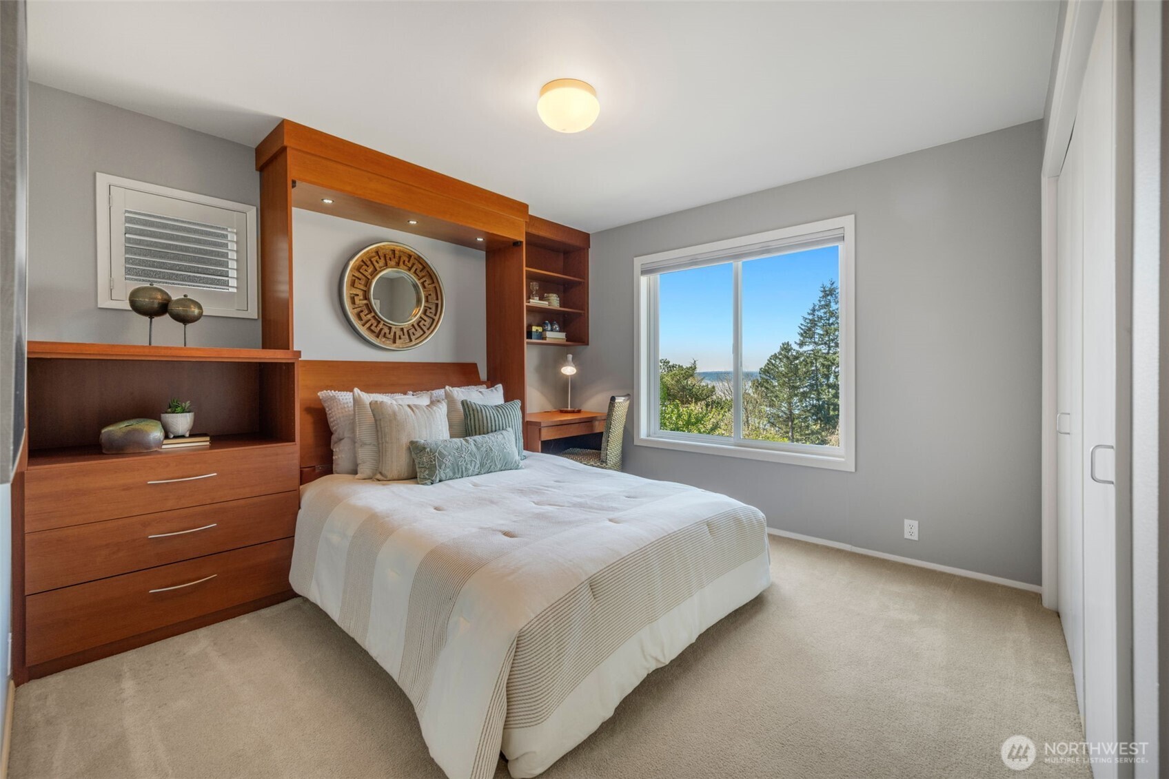 4017 56th Avenue Southwest Seattle, WA 98116 - Photo 22 of 39 a bedroom with a bed and a window