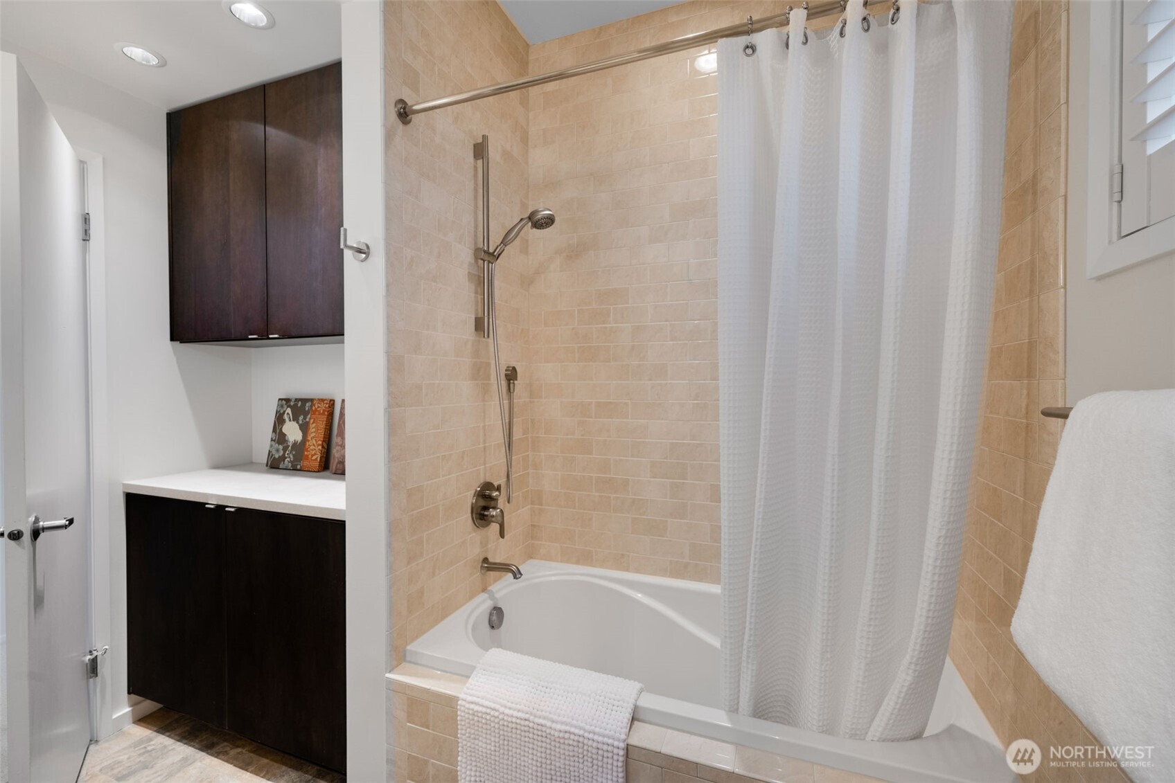 4017 56th Avenue Southwest Seattle, WA 98116 - Photo 24 of 39 a bathroom with a bathtub and a shower