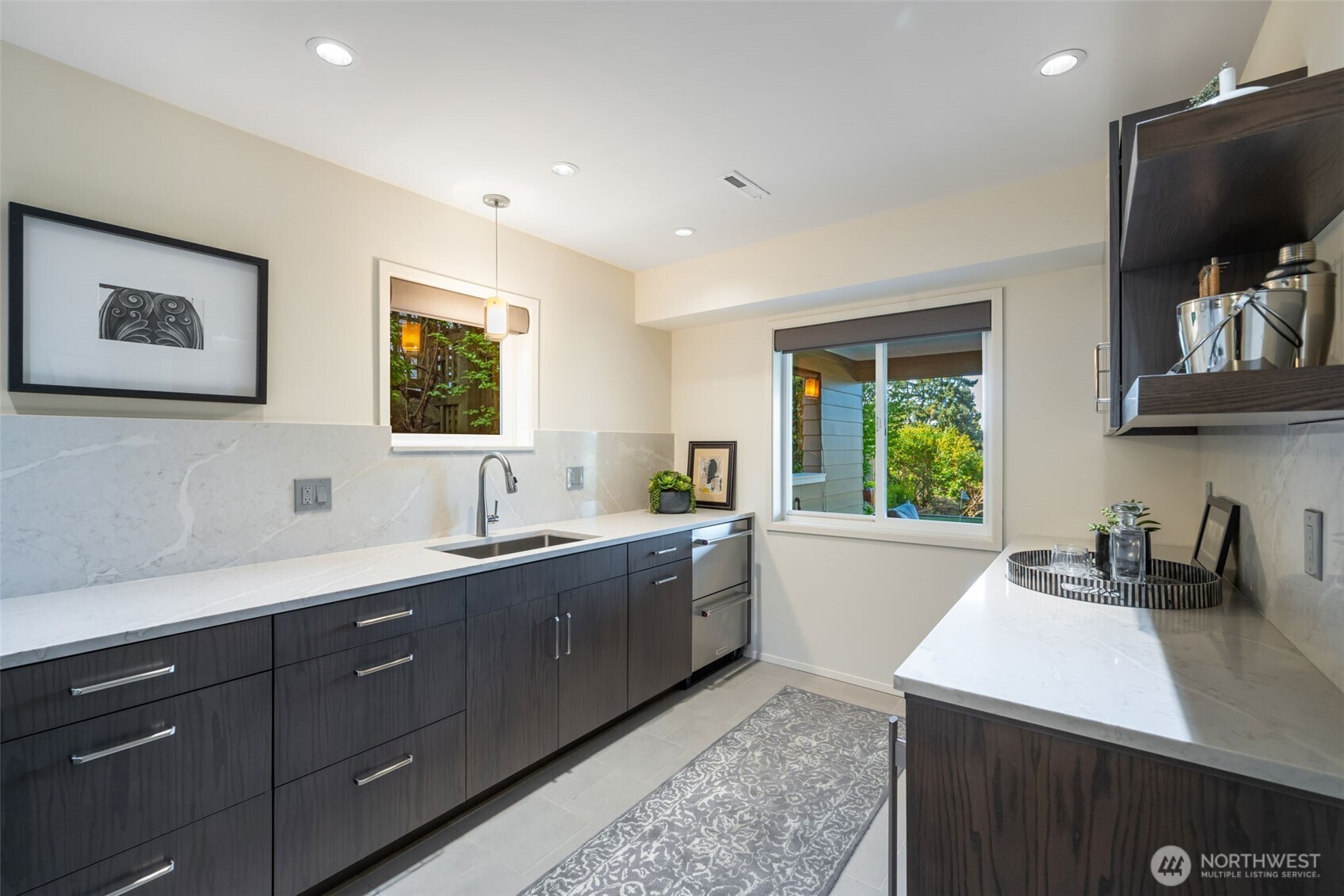 4017 56th Avenue Southwest Seattle, WA 98116 - Photo 28 of 39 a kitchen with sink cabinets and window