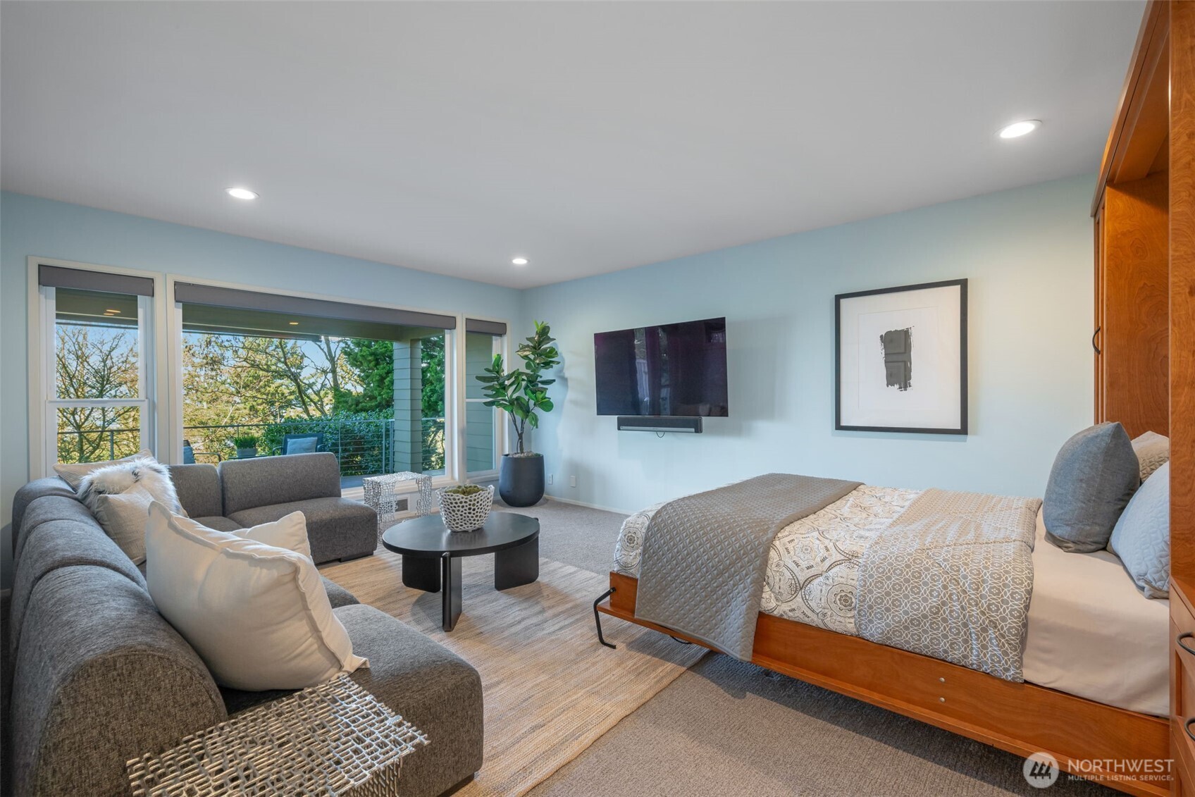 4017 56th Avenue Southwest Seattle, WA 98116 - Photo 31 of 39 a bedroom with furniture and a large window