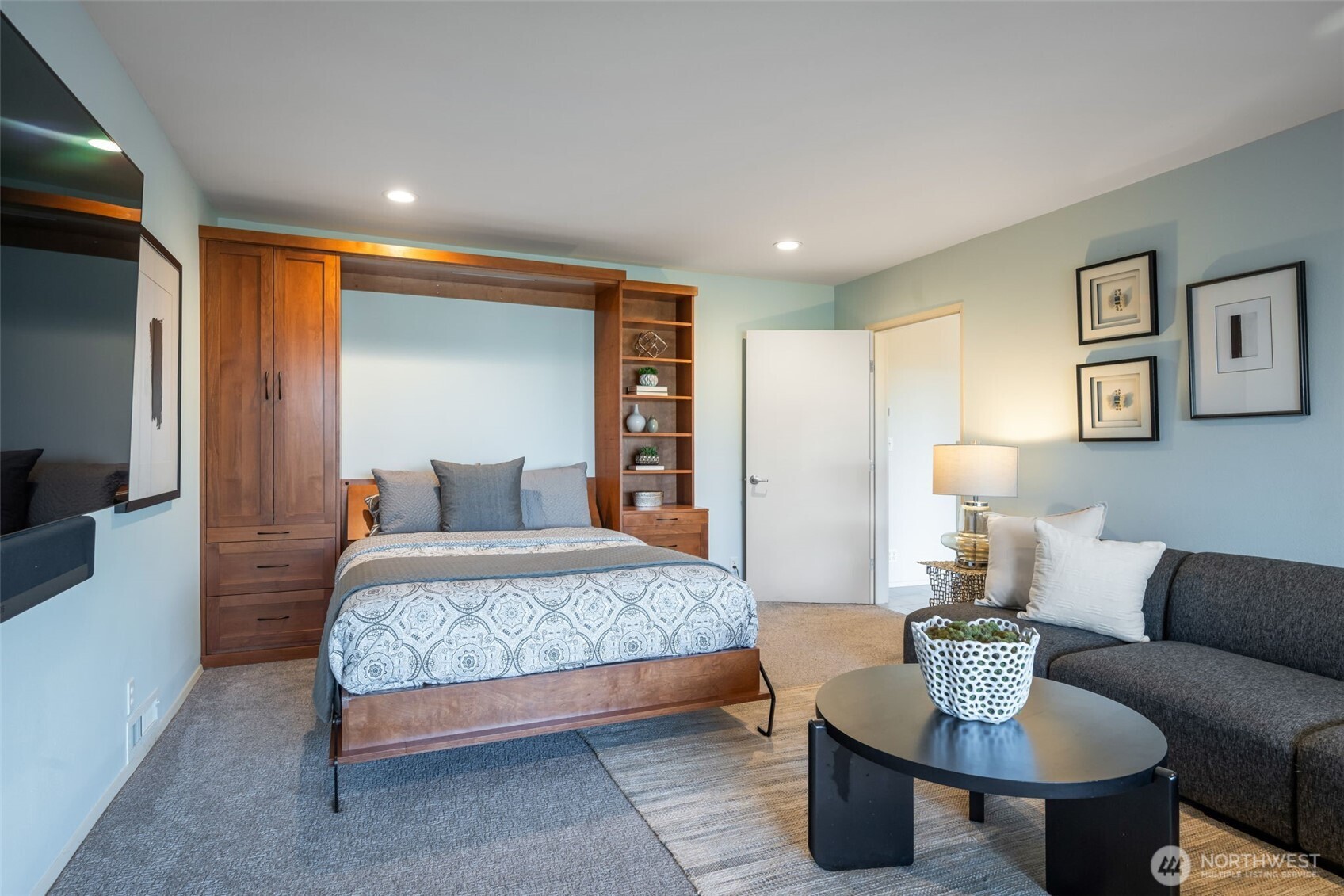 4017 56th Avenue Southwest Seattle, WA 98116 - Photo 32 of 39 a bedroom with a bed and a couch