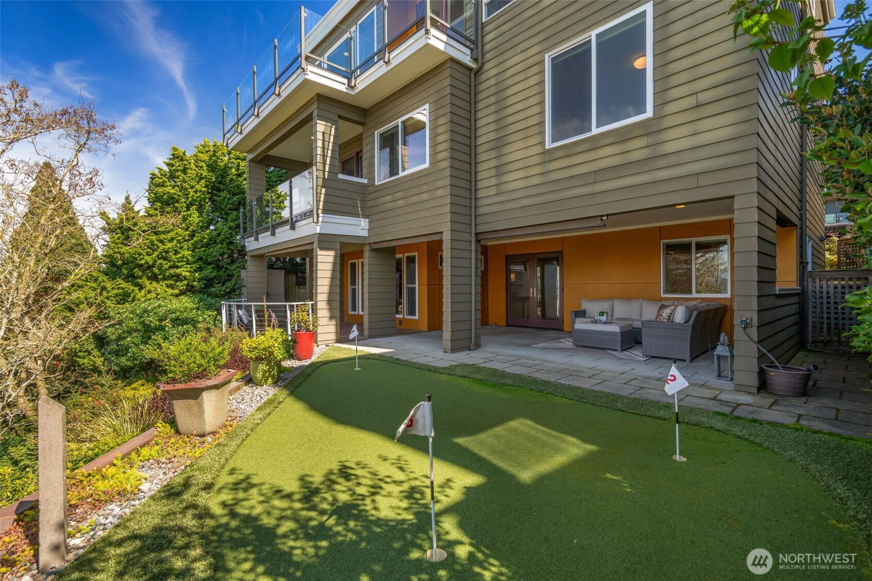 4017 56th Avenue Southwest Seattle, WA 98116 - Photo 34 of 39 a view of a house with backyard porch and sitting area