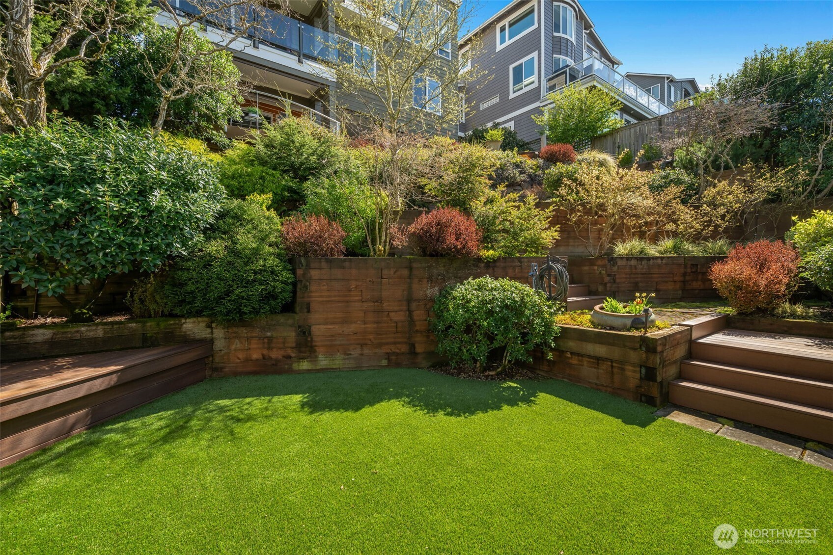 4017 56th Avenue Southwest Seattle, WA 98116 - Photo 38 of 39 a backyard of a house with lots of green space