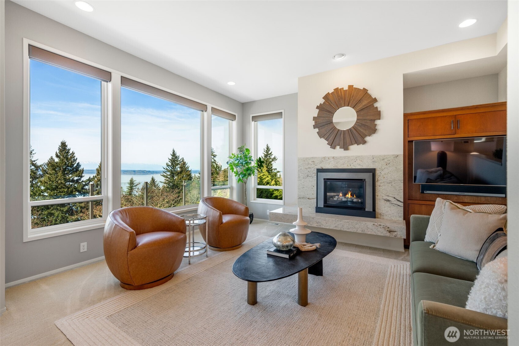 4017 56th Avenue Southwest Seattle, WA 98116 - Photo 5 of 39 a living room with furniture a flat screen tv and a fireplace