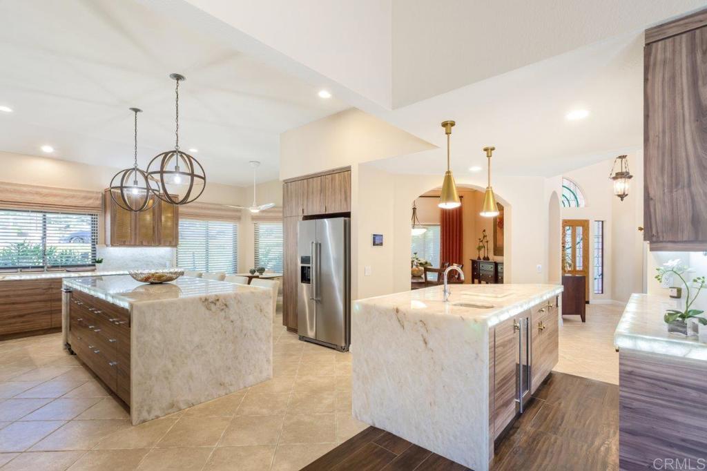 9369 Quail Canyon Road El Cajon, CA 92021 - Photo 12 of 43 a kitchen with sink a refrigerator and washer