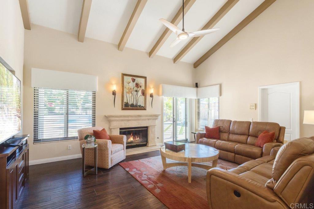 9369 Quail Canyon Road El Cajon, CA 92021 - Photo 15 of 43 a living room with furniture fireplace and a large window