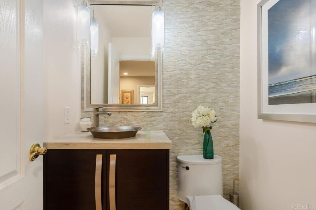 9369 Quail Canyon Road El Cajon, CA 92021 - Photo 19 of 43 a bathroom with a sink and a mirror