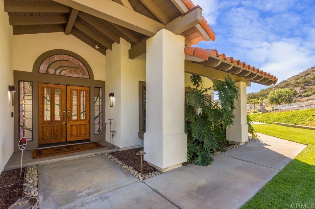 9369 Quail Canyon Road El Cajon, CA 92021 - Photo 2 of 43 a view of a house with backyard and garden
