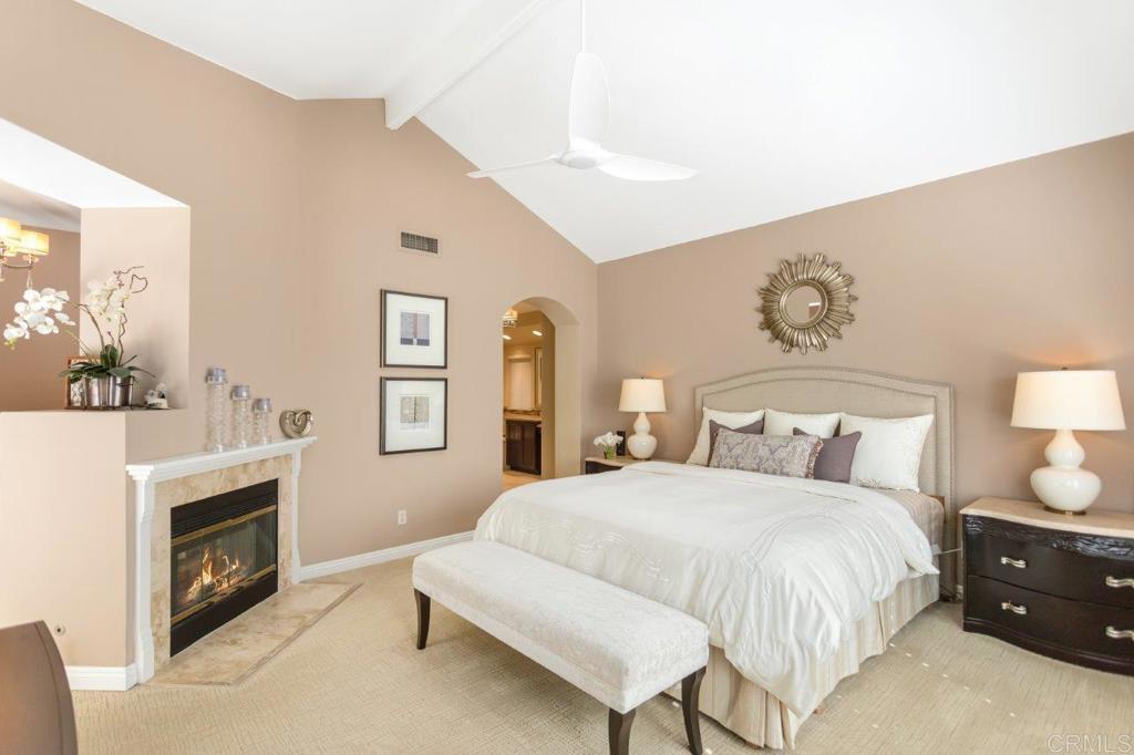 9369 Quail Canyon Road El Cajon, CA 92021 - Photo 26 of 43 a spacious bedroom with a bed and a fireplace